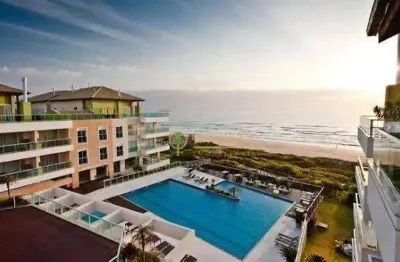 Frente mar à venda na praia do santinho! sacada com jacuzzi, semi mobiliado, 2 quartos e 1 vaga de garagem.