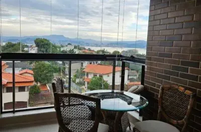 Apartamento de 3 quartos à venda em Florianópolis/SC! Semi Mobiliado, Sacada com Churrasqueira e 2 vagas - Bairro Coqueiros/Itaguaçu.