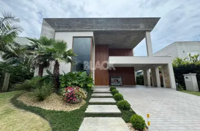 Casa com 4 suítes no condomínio ocean side em torres rs