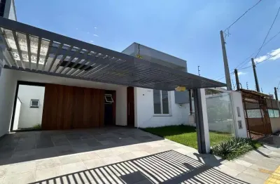 Casa nova e moderna no bairro igara em canoas - pé direito alto - porcelanato - churrasqueira - vaga de garagem coberta para 2 carros.