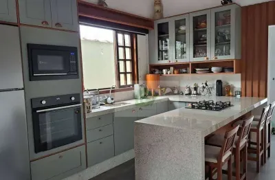 Casa com 4 dormitórios suíte à venda, 174 m² por r$ 695.000 - massaguaçu - caraguatatuba/sp