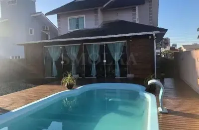 Casa em condomínio fechado com 4 quartos à venda na rua da saracura, pedra branca, palhoça, 245 m2 por r$ 1.730.000