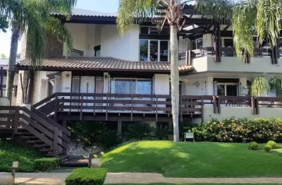 Casa em condomínio fechado com 5 quartos à venda na rua dos tambaquis, jurerê internacional, florianópolis, 600 m2 por r$ 8.250.000