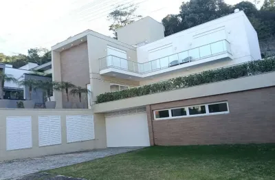 Casa em condomínio fechado com 4 quartos para alugar na Rodovia Admar Gonzaga, 3180, Itacorubi, Florianópolis
