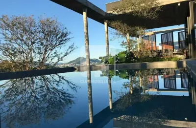 Casa em condomínio fechado com 3 quartos à venda na Rodovia Haroldo Soares Glavan, 1830, Cacupé, Florianópolis