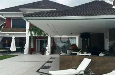 Casa com 4 suítes e lazer privativo em condomínio na barra da tijuca - porteira fechada