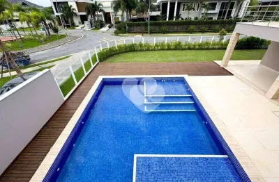 Condomínio alphaville - casa triplex contemporânea sendo 1º locação e com elevador. 5 suítes com closet. barra da tijuca/rj.