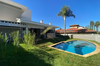 Casa à venda no alphaville campinas com 4 quartos (2 suítes térreas), lazer privativo e garagem para vários carros.