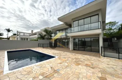 Casa à venda no alphaville campinas, com 4 suítes, lazer comum e garagem para vários carros.