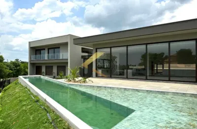 Casa em condomínio à venda em sousas - campinas, com 4 suítes (1 máster), lazer comum e garagem para 4 carros.