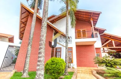 Casa à venda em condomínio próximo ao shopping galleria - campinas, com 4 suítes (2 americanas) lazer e garagem para 7 veículos.