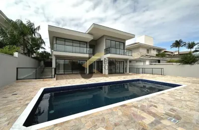Casa para aluguel no alphaville campinas, com 4 suítes, lazer comum e garagem para vários carros.
