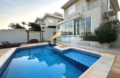 Casa à venda no alphaville dom pedro - campinas, com 3 suítes, lazer privativo com piscina e garagem para 4 carros.