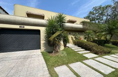 Casa em condomínio à venda no Parque Nova Campinas, com 4 suítes, lazer privativo, elevador e garagem para vários carros.