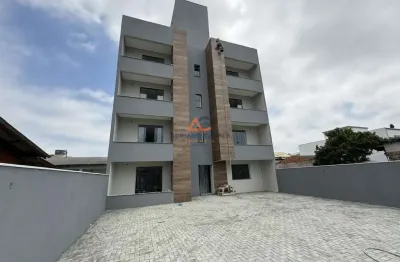 Apartamento de dois dormitórios, sendo uma suíte, sacada com churrasqueira e uma vaga de garagem no bairro de gravatá, em navegantes - adriano carpes imóveis vende