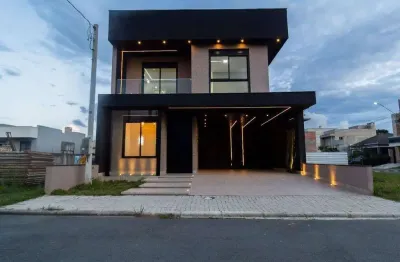 Sobrado com 3 dormitórios, incluindo uma suíte, garagem para 4 vagas no umbara