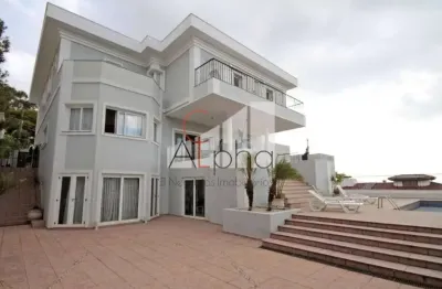 Casa em condomínio fechado com 6 quartos para alugar na alameda itatiaia, 304, alphaville, santana de parnaíba por r$ 65.000