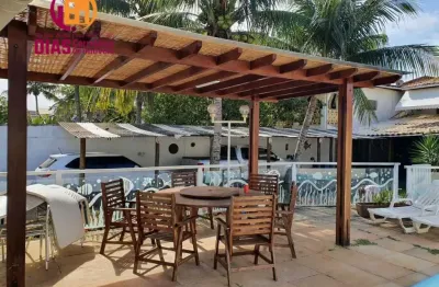 Vendo em oportunidade 2 casas em um terreno com 518m2 de área total com clube com piscina  espaço gourmet garagem coberta com 5/4, sendo 3 suítes em ipitanga próximo praia  em rua familiar e super seg
