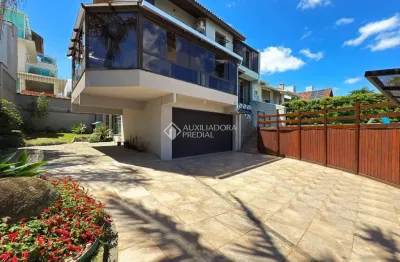 Casa em condomínio fechado com 3 quartos à venda na rua alcebíades antônio dos santos, 356, nonoai, porto alegre, 330 m2 por r$ 1.720.000