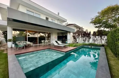 Casa com 4 quartos à venda na rua dos botos, 345, jurerê internacional, florianópolis por r$ 7.800.000