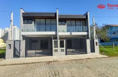 Sobrado de padrão médio/alto com 154 m2, a venda no bairro itacolomi, balneário de piçarras