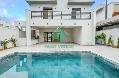 Sobrado novo 4 dorm sendo 3 suítes com piscina em condomínio costa nova