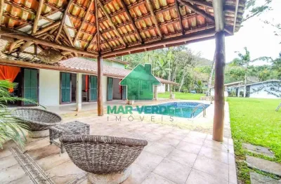 Casa com 4 lotes e 5 dormitórios e piscina em condomínio exclusivo no mar verde i