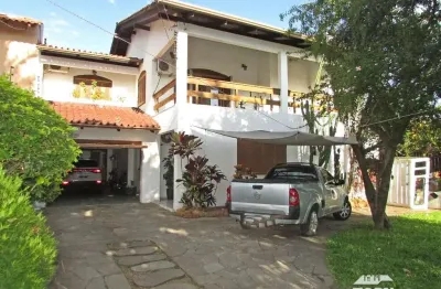 Casa com 5 quartos à venda na rua zeferino dias, 510, cavalhada, porto alegre por r$ 1.250.000