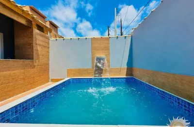 Linda casa nova na praia com piscina com cascata e área gourmet