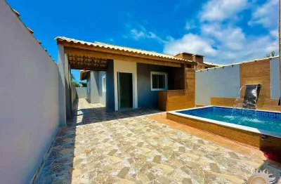 Linda casa nova na praia com piscina com cascata e área gourmet