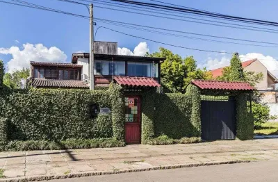 Casa em condomínio fechado com 3 quartos à venda na Avenida Guarujá, 140, Guarujá, Porto Alegre