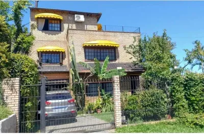 Casa em condomínio fechado com 4 quartos à venda na Rua Arapei, 325, Cristal, Porto Alegre