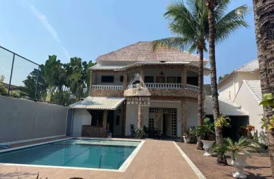 Casa triplex com 4 suítes, 4 vagas e lazer completo no núcleo das mansões