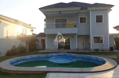 Excelente casa duplex em condomínio fechado, piscina, campo de futebol, 370 m²