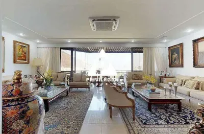 Cobertura duplex de 540m² na lagoa: 4 suítes, piscina, sauna e vista frontal