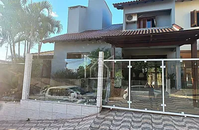 Casa com 4 quartos à venda na Rua Luiz Linck Barcelos, 160, Loteamento Jardim Timbaúva, Gravataí