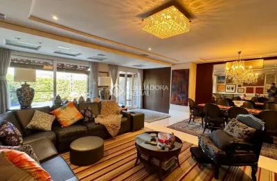 Casa em condomínio fechado com 3 quartos à venda na rua ênio andrade, 320, três figueiras, porto alegre, 329 m2 por r$ 4.499.000