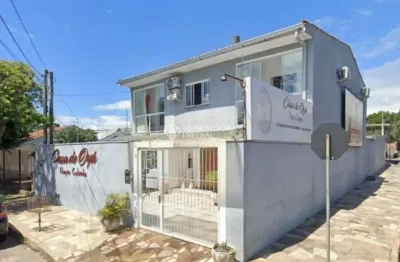 Casa com 3 quartos à venda na rua ângelo barboza, 108, cavalhada, porto alegre, 220 m2 por r$ 900.000