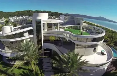 Linda mansão frente mar em jurerê internacional, para venda e locação de temporada, totalmente auto