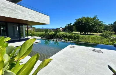 Casa de luxo à venda no joinville country club – 5 suítes, piscina com raia e automação completa!