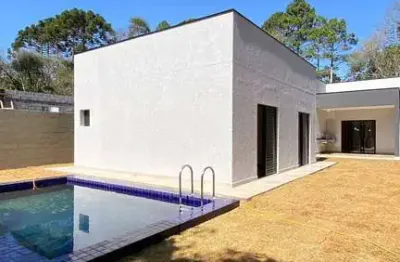 Casa nova térrea com 3 suítes quintal com piscina em condomínio