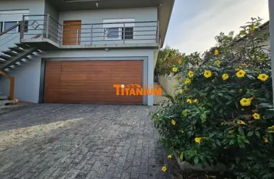 Casa com 3 dormitórios, sendo uma suíte com closet, moderna, piscina, pátio amplo à venda em novo hamburgo, ideal - 233m².