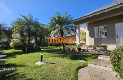 Casa à venda com 4 dormitórios, piscina, área gourmet, maravilhoso jardim no bairro ideal em novo hamburgo.