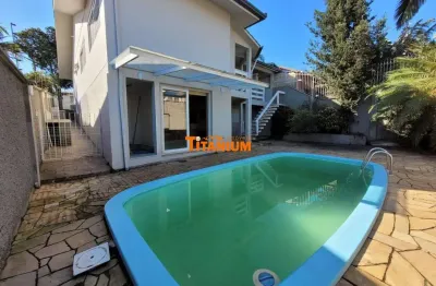 Casa à venda em petrópolis, novo hamburgo - 3 dormitórios sendo 1 suíte. churrasqueira, piscina e garagem coberta