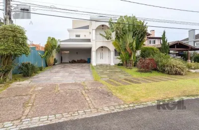 Casa em condomínio à venda no bairro Belém Novo com 420 m² e 3 dormitórios/quartos.