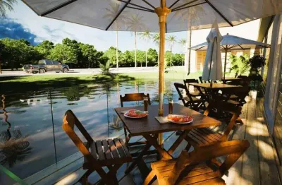 Casa em condomínio fechado com 3 quartos à venda na praia do ouvidor, garopaba  por r$ 2.950.000