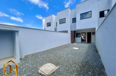 Sobrado geminado com 1 suíte mais 2 quartos no bairro iririú