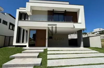 Casa com piscina em frente à praça - 5 suítes - condomínio alphaville ii