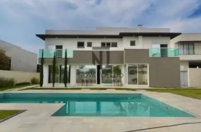 Casa de condomínio com 5 quartos sendo 4 suítes, terreno com 1.200 metros - chácaras serimbura.