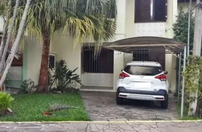 Casa em condomínio fechado com 3 quartos à venda na avenida juca batista, 4115, hípica, porto alegre, 99 m2 por r$ 499.000